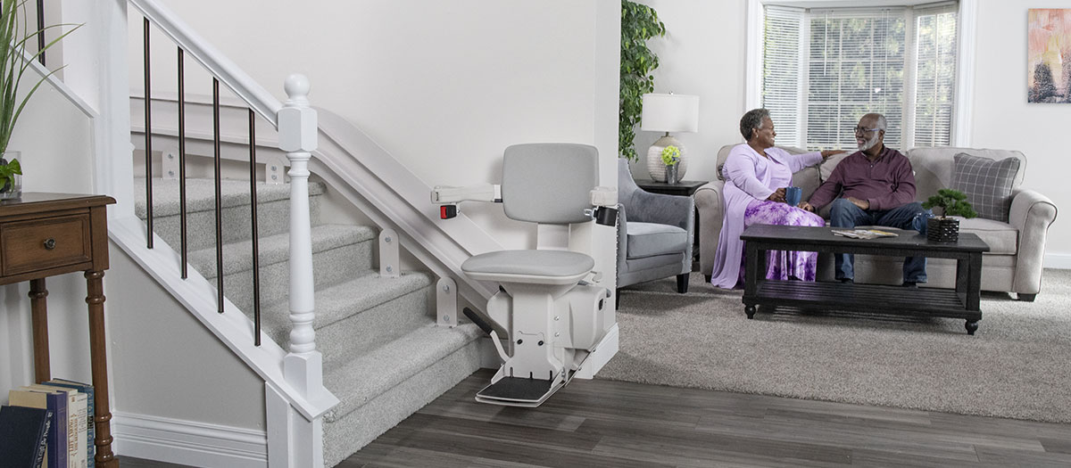Bruno Elite curved stairlift in front of living room