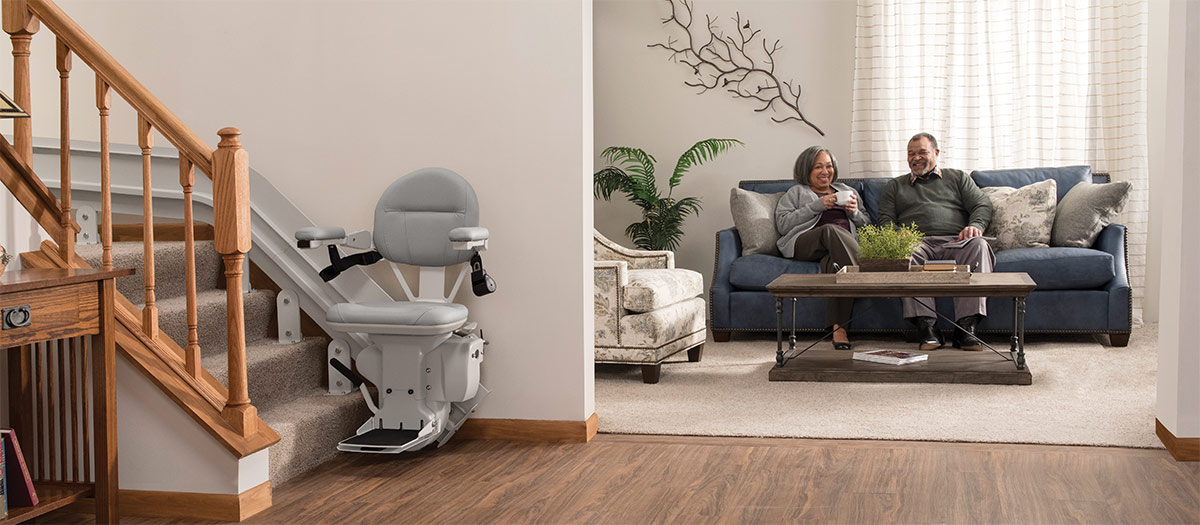 Bruno Elite curved stairlift in front of living room