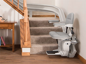 Bruno Elite curved stairlift at the bottom of a staircase