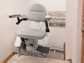 Bruno Elite curved stairlift seat rotated at the top of the stairs